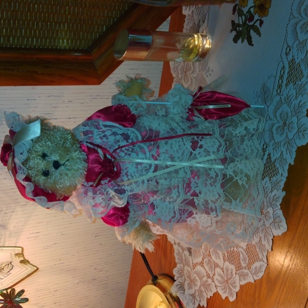 Bear dressed in lace, on stand